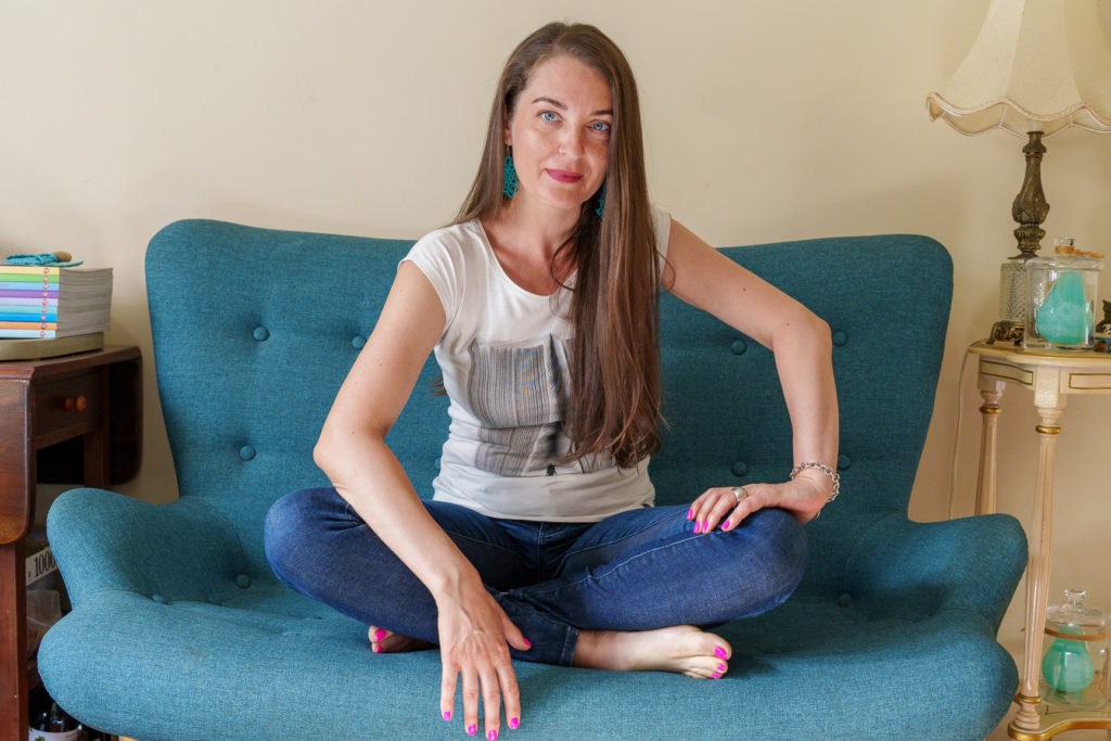 Mona, Counsellor in Bondi sitting on couch